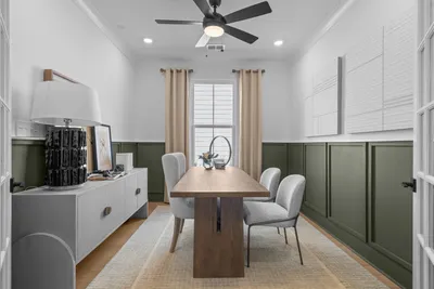 Modern kitchen with white cabinetry and pendant lighting