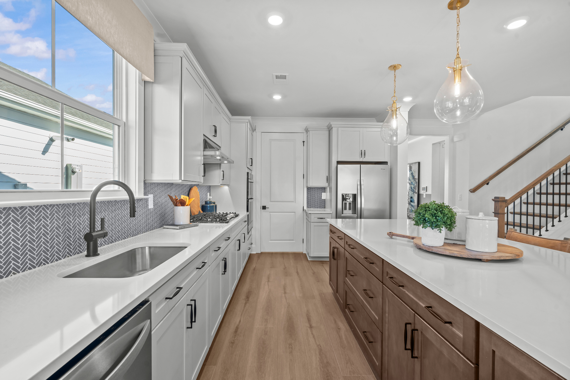 Spacious primary bedroom with tray ceiling